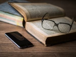 book, glasses, and phone