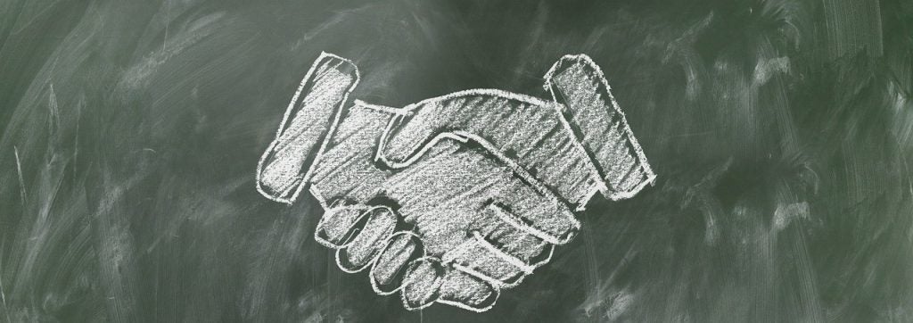 chalk drawing of handshake