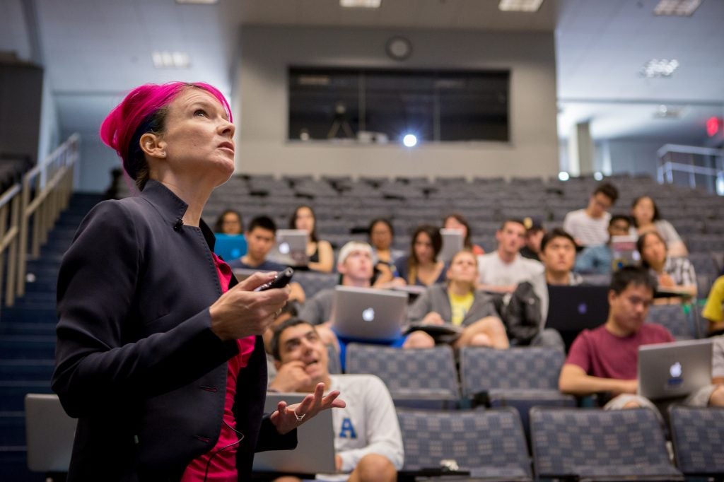 professor teaching a class in an auditorium