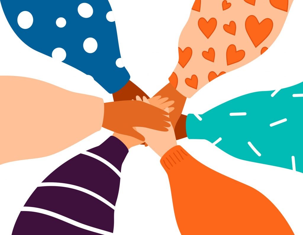 six female hands support each other, concept of teamwork and friendship
