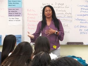 veda ramsay stamps teaching a class