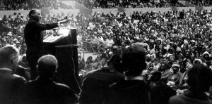 martin luther king making a speech at podium