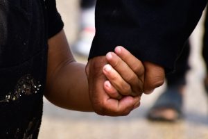 two people holding hands