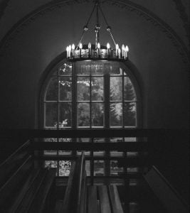 tall building interior with window in black and white