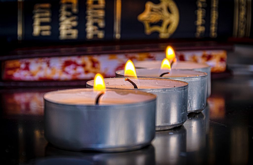lit candles in a synagogue