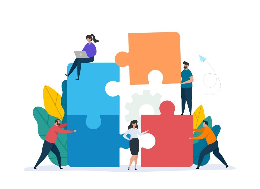 illustration of people moving giant puzzle pieces together and demonstrating teamwork