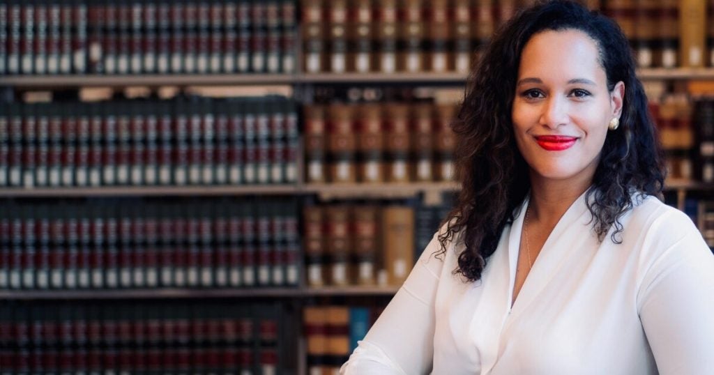 anna spain bradley surrounded by legal books