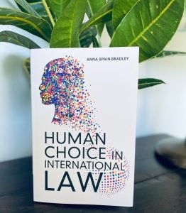 hard copy of vc anna spain bradley's book, human choice in international law by a houseplant