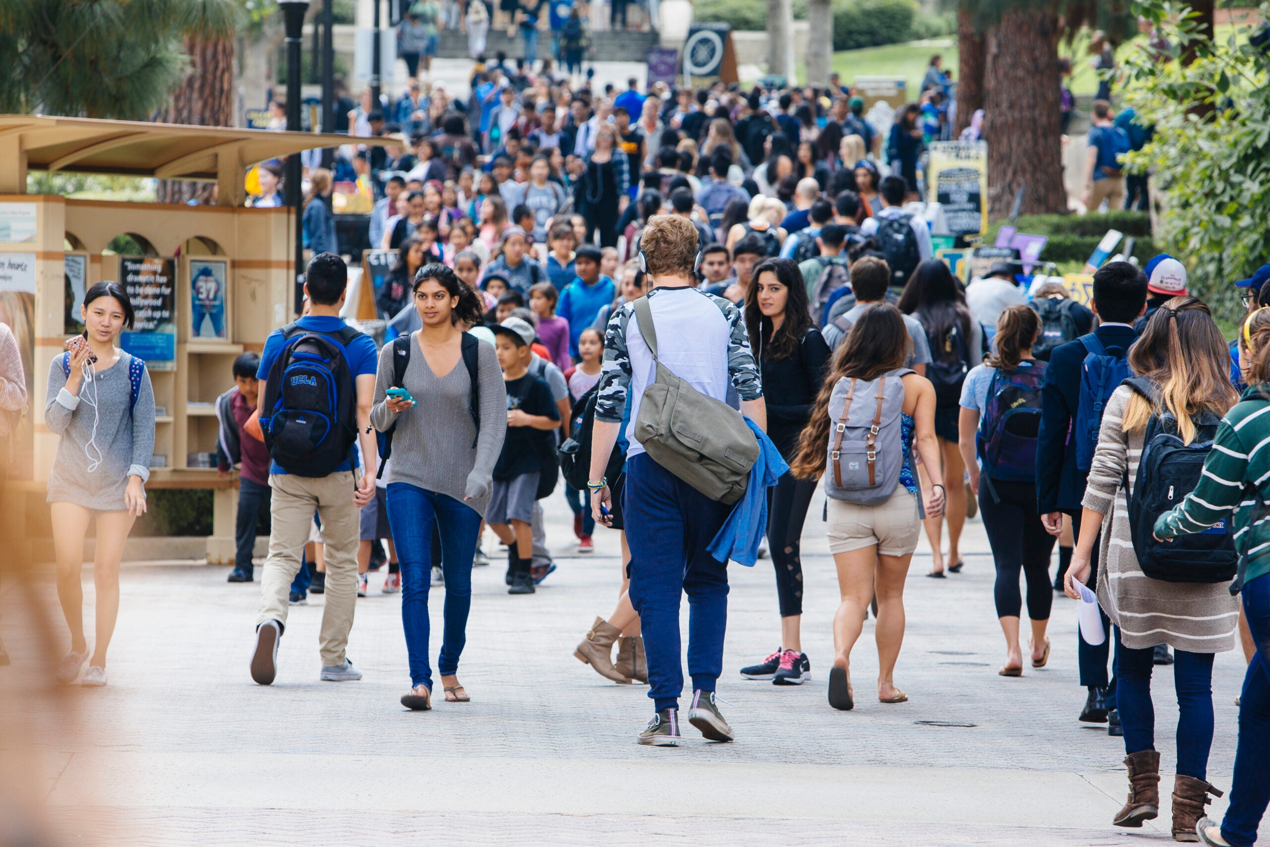 large, diverse group of ucla students walking on bruin walk