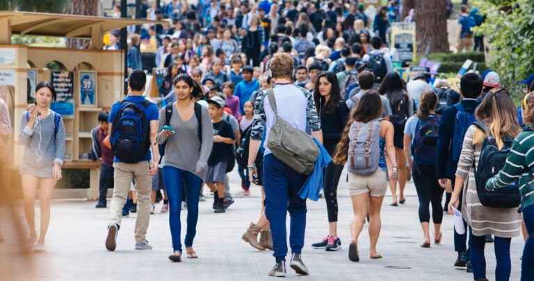 large, diverse group of ucla students walking on bruin walk
