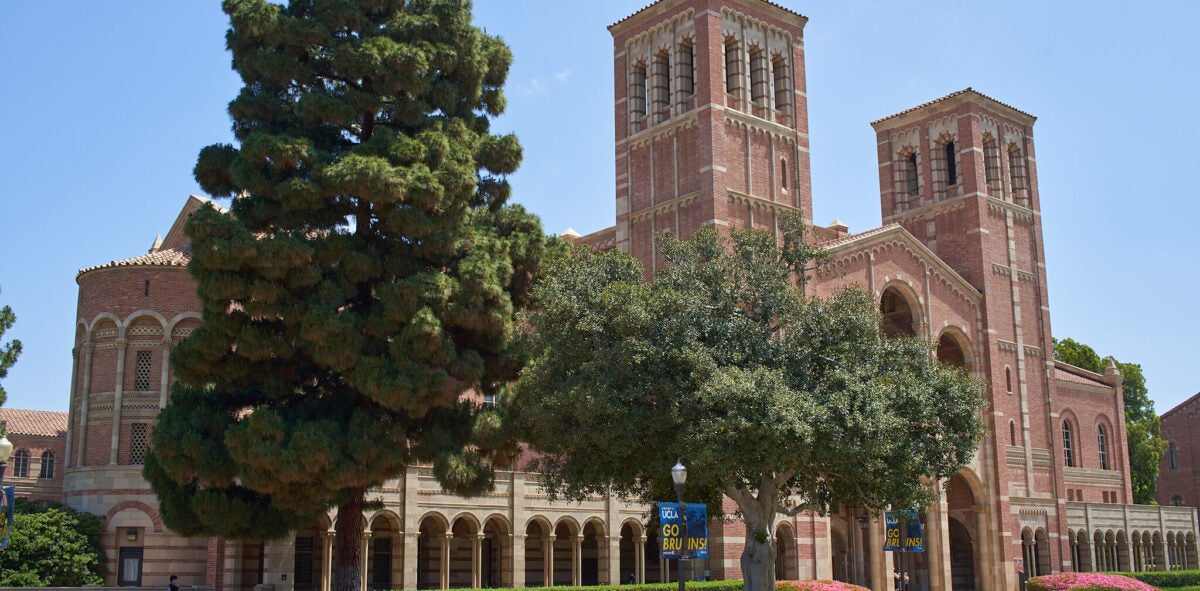 ucla royce hall, with peiple sitting and walking nearby
