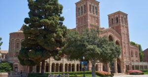 ucla royce hall, with peiple sitting and walking nearby