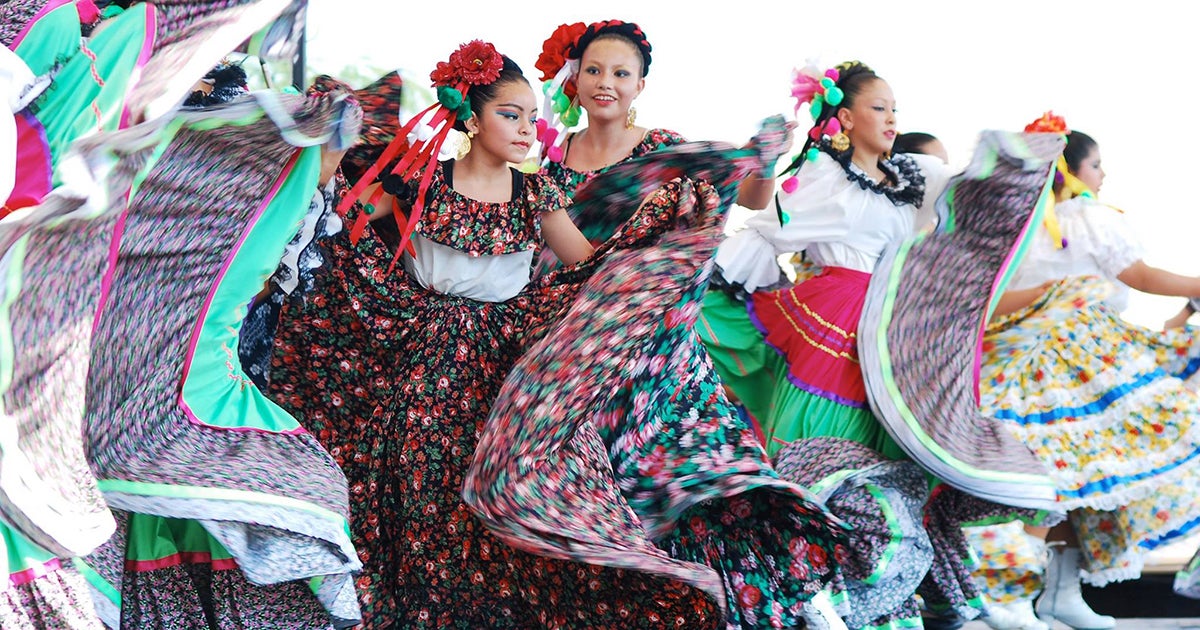 latinx dancers in traditional clothing in celebration of hispanic heritage month